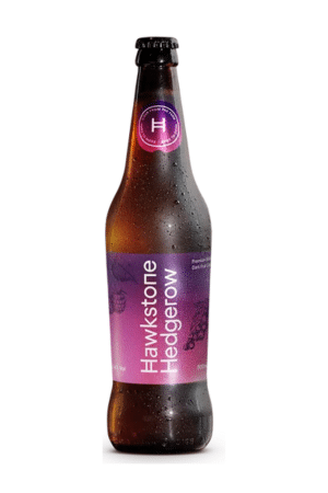 Brown glass beer bottle with a purple label and condensation on the surface, standing upright.